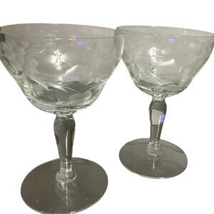 vintage etched crystal champagne coupe glasses featuring a floral and vine motif